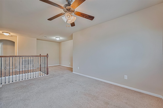 empty room with light carpet and ceiling fan