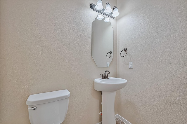 bathroom with sink and toilet