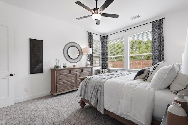 bedroom featuring a ceiling fan, carpet, visible vents, and baseboards