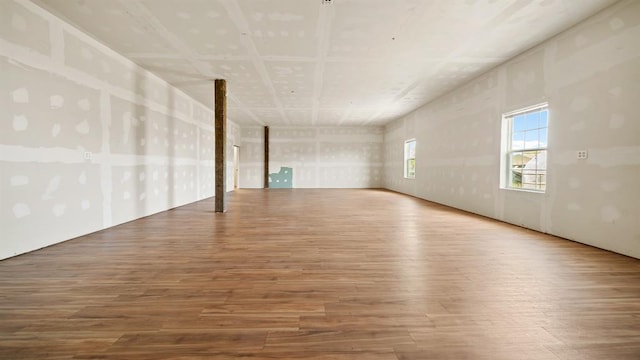 unfurnished room with hardwood / wood-style flooring