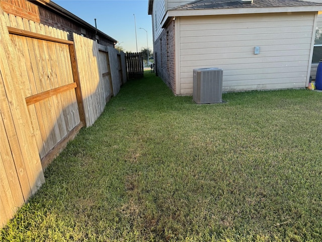 view of yard featuring central AC unit