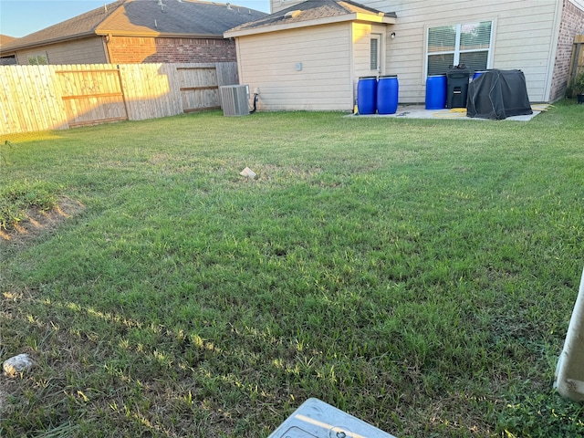 view of yard with central AC