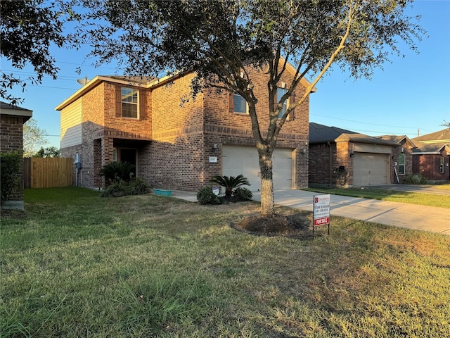 view of front of home featuring a garage and a front lawn