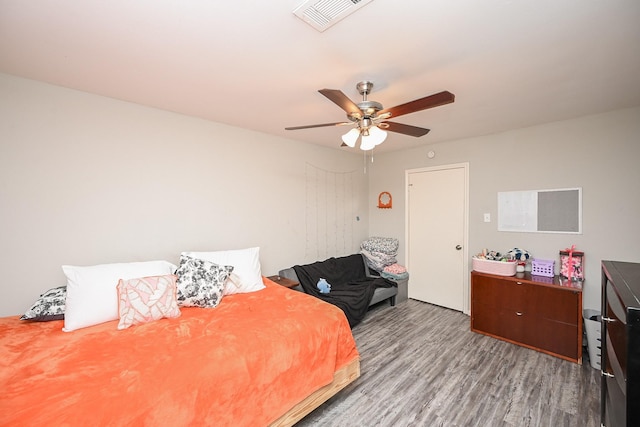 bedroom with hardwood / wood-style flooring and ceiling fan