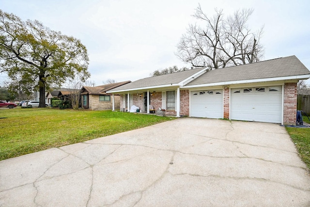 single story home with a garage and a front lawn