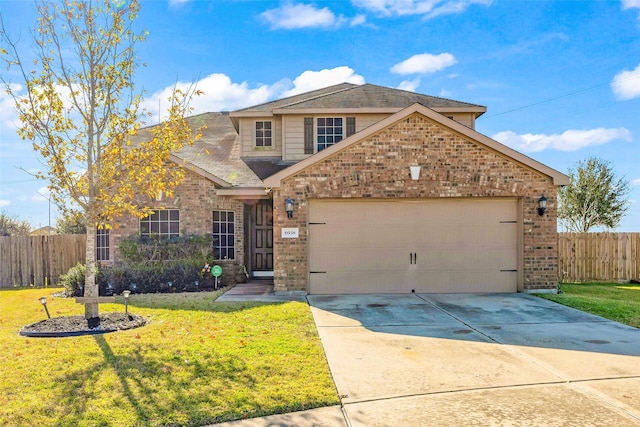 front of property with a garage and a front lawn