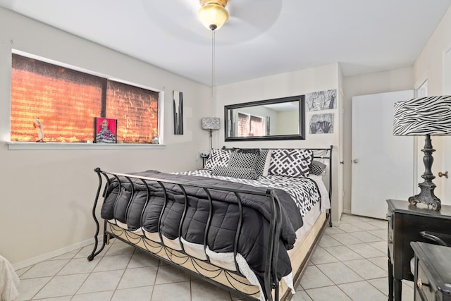 tiled bedroom with ceiling fan