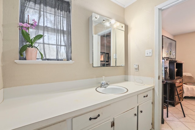 bathroom with tile patterned flooring and vanity