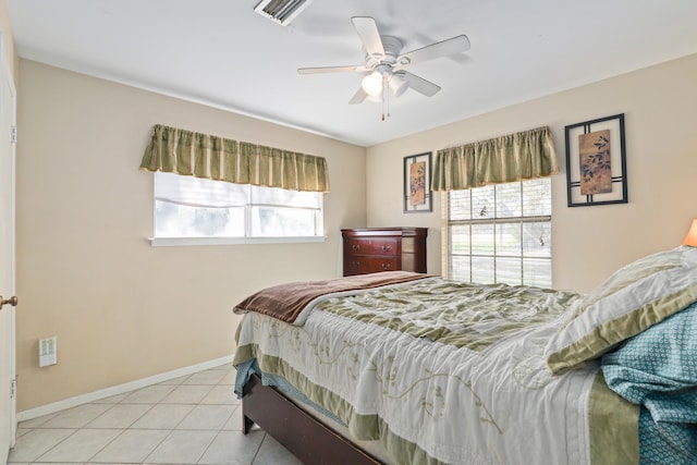 bedroom featuring light tile patterned floors and ceiling fan