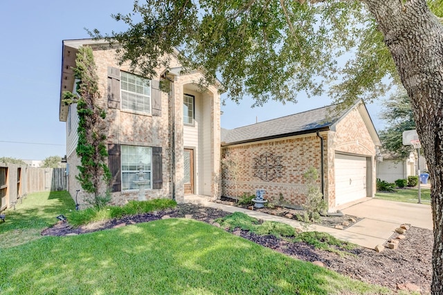 view of front of property featuring a garage and a front lawn