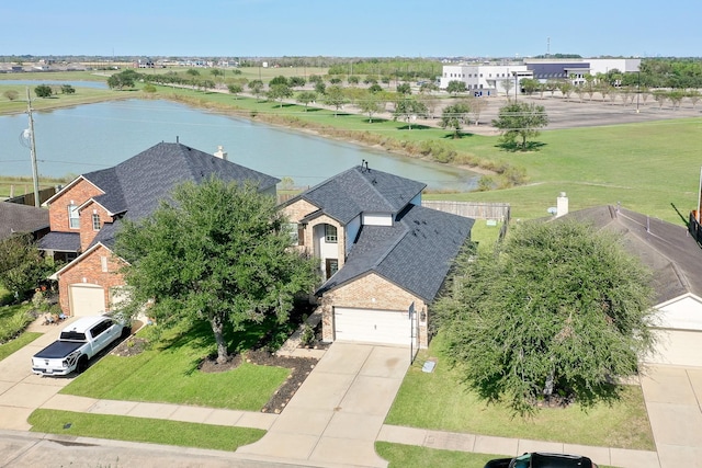 bird's eye view with a water view