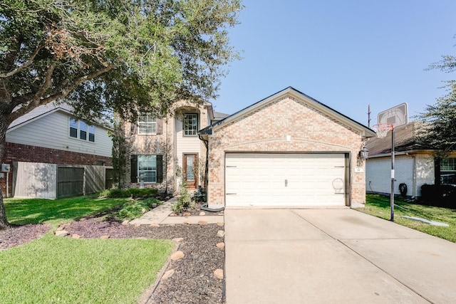 view of front property with a garage and a front yard