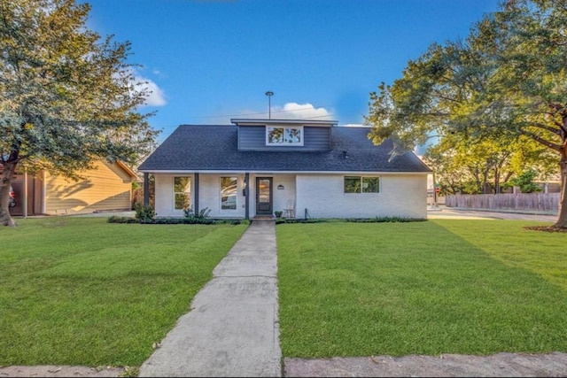 view of front of home with a front lawn