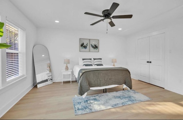 bedroom featuring ceiling fan and light hardwood / wood-style floors