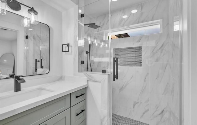 bathroom with vanity and walk in shower