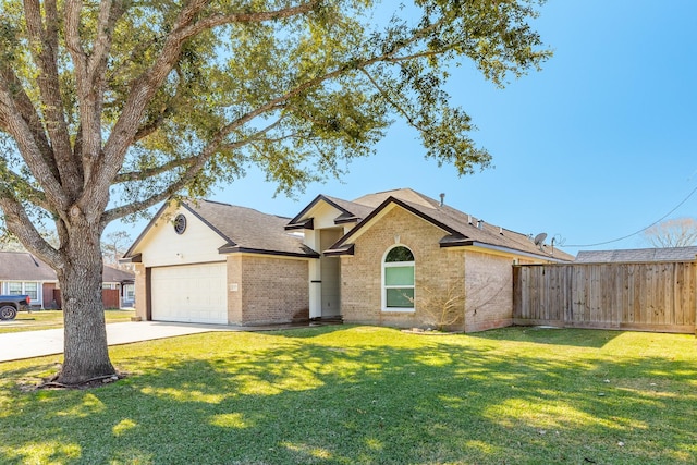 ranch-style home featuring a garage and a front lawn