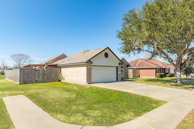 view of front of property with a garage and a front yard