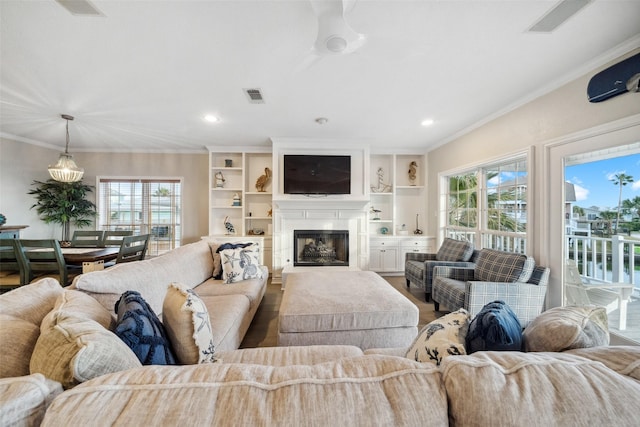 living room featuring crown molding