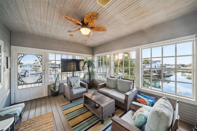 sunroom with wooden ceiling and ceiling fan