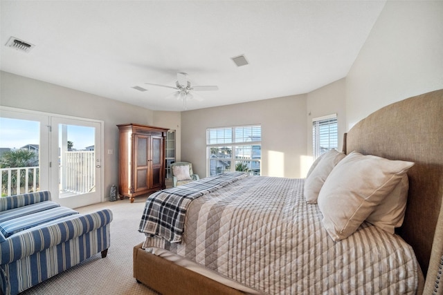 carpeted bedroom featuring access to exterior and ceiling fan