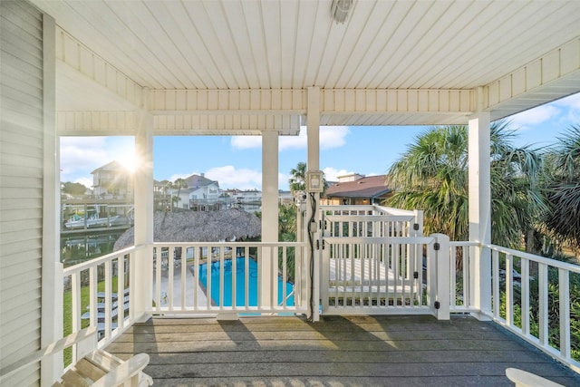 unfurnished sunroom featuring a water view