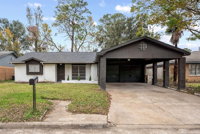 ranch-style house featuring a carport, a garage, and a front lawn