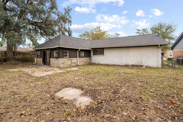 back of property with a patio