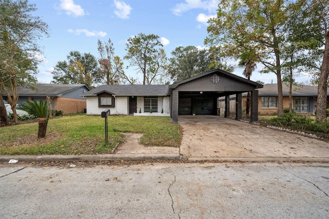 ranch-style house featuring a carport and a front lawn