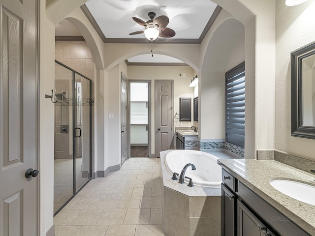 bathroom featuring vanity, crown molding, independent shower and bath, and a healthy amount of sunlight