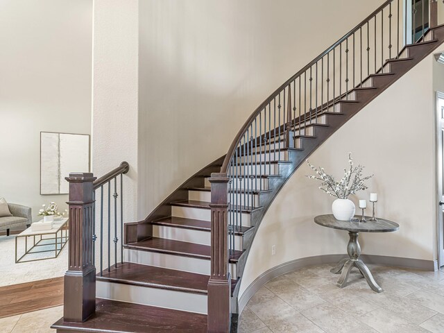 stairs with tile patterned flooring