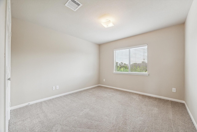 spare room featuring carpet flooring