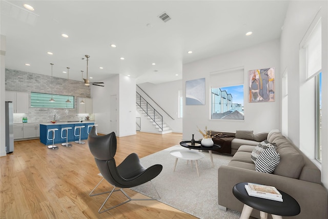 living room featuring sink and light wood-type flooring