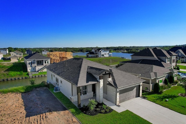 birds eye view of property with a water view