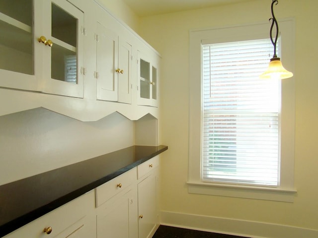 kitchen featuring pendant lighting and white cabinets