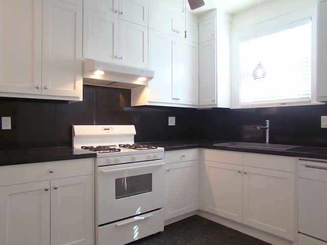 kitchen with sink, white appliances, white cabinets, and ceiling fan