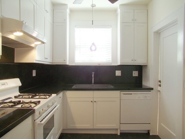 kitchen featuring sink, white appliances, and white cabinets