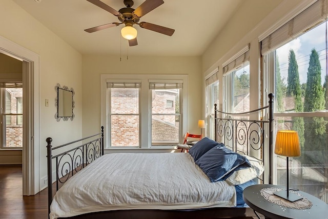 bedroom featuring ceiling fan and dark hardwood / wood-style floors