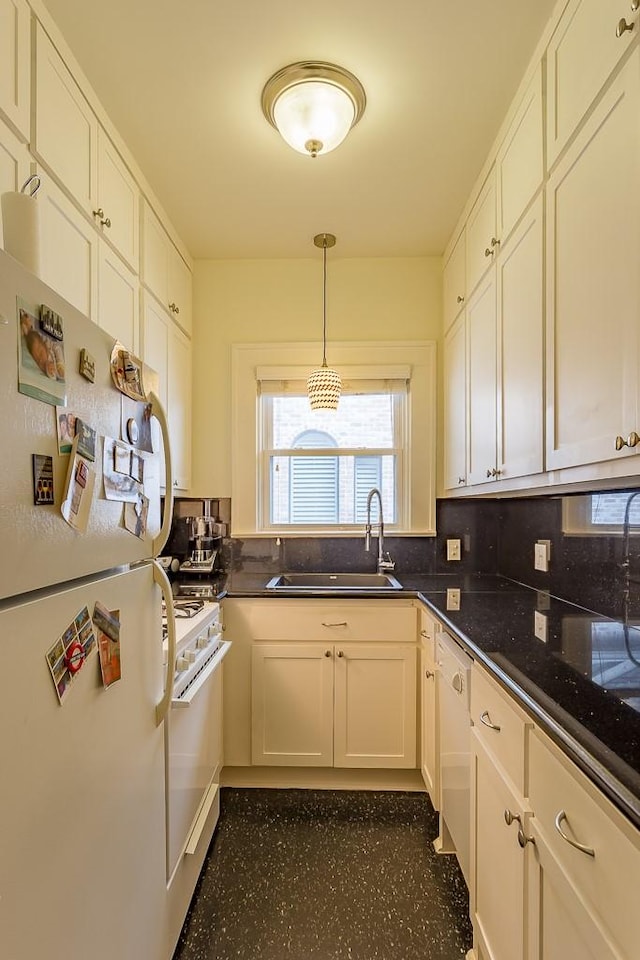 kitchen featuring sink, white appliances, white cabinetry, hanging light fixtures, and decorative backsplash