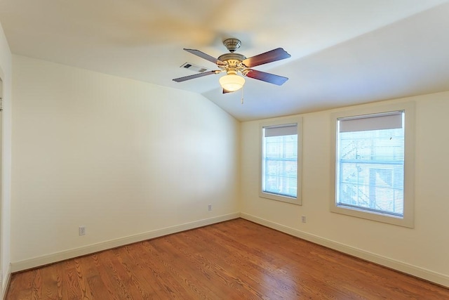 unfurnished room featuring light hardwood / wood-style flooring, ceiling fan, and vaulted ceiling