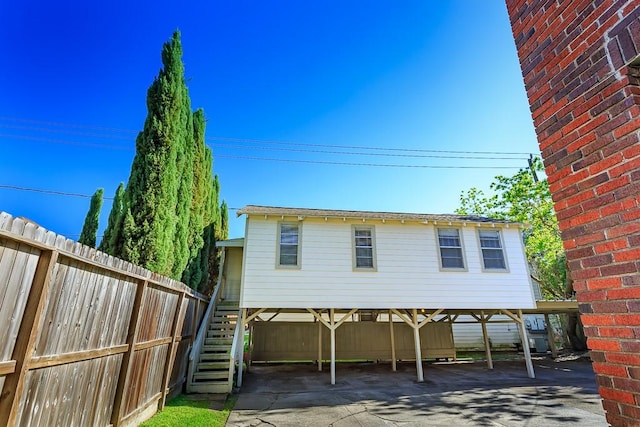 rear view of property featuring a carport