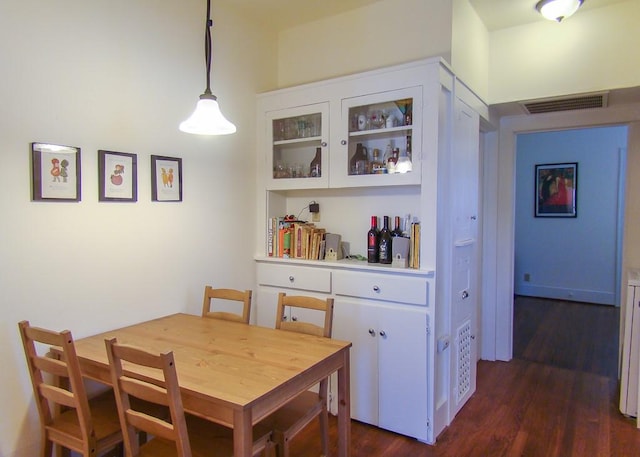 dining room featuring dark hardwood / wood-style flooring