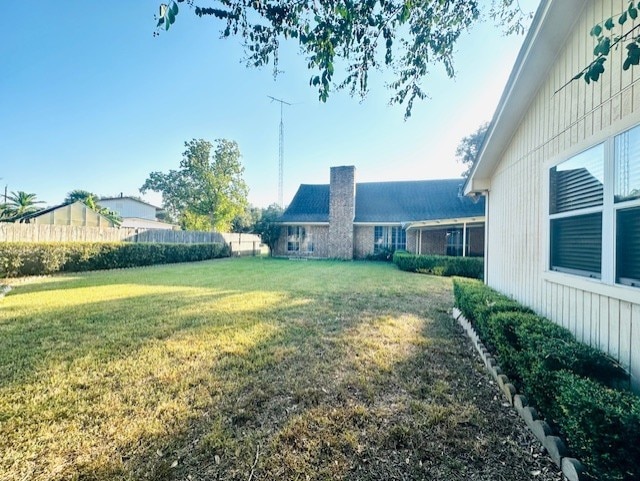 view of yard featuring fence