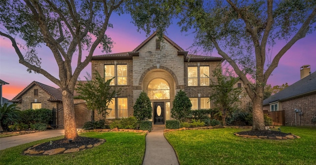 view of front of property with a yard