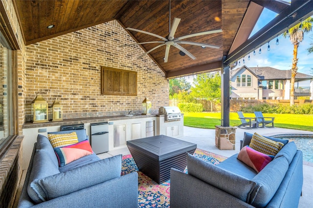 view of patio / terrace with area for grilling, an outdoor living space, and ceiling fan