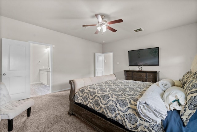 carpeted bedroom featuring ceiling fan and ensuite bathroom