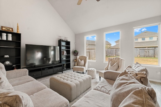 living room with ceiling fan and lofted ceiling