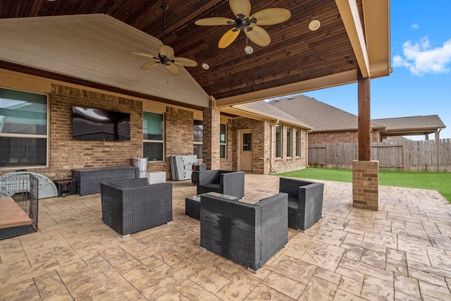 view of patio with outdoor lounge area and ceiling fan