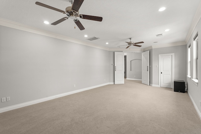 carpeted empty room featuring crown molding