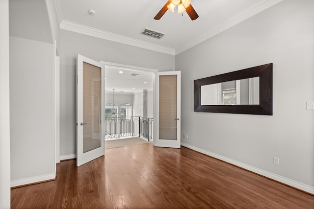 spare room with french doors, ceiling fan, ornamental molding, and wood-type flooring