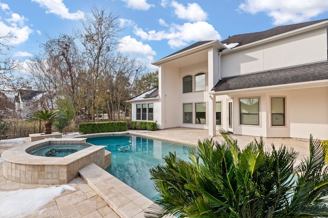 view of swimming pool with a patio area and an in ground hot tub